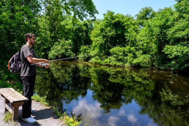 Austin Dean fishes along the Lehigh Canal in the hot weather Monday, July 13, 2026, in Bethlehem. The Lehigh Valley is under a heat advisory from the National Weather Service through 8 p.m. Wednesday.(April Gamiz/The Morning Call)