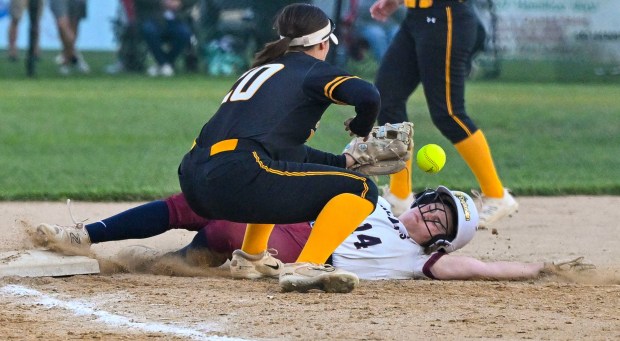 Liberty's Leah Onia slides into 3rd base as Freedom's Maia D'Amico tries to catch the ball and make the tag on Thursday, May 30, 2024, during the District 11 6A softball championship at Patriots Park in Allentown. (April Gamiz/The Morning Call)