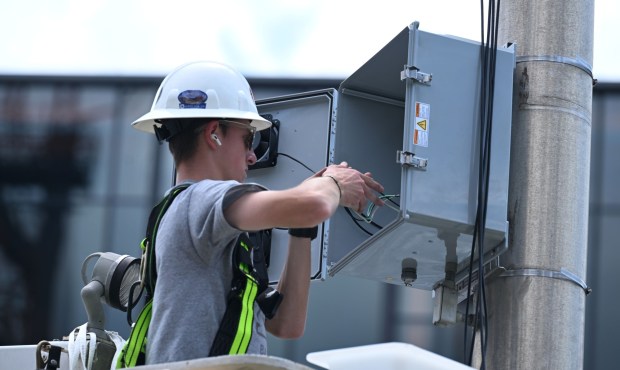 Evan Eisenhard, an engineer with Service Electric, works on a Wi-Fi switch cabinet Wednesday, July 22, 2026, near Levitt Pavilion in preparation for Musikfest in Bethlehem. The 10-day, free music festival in both North and South Side Bethlehe runs July 31-Aug. 9. (Jon Chiu/The Morning Call)
