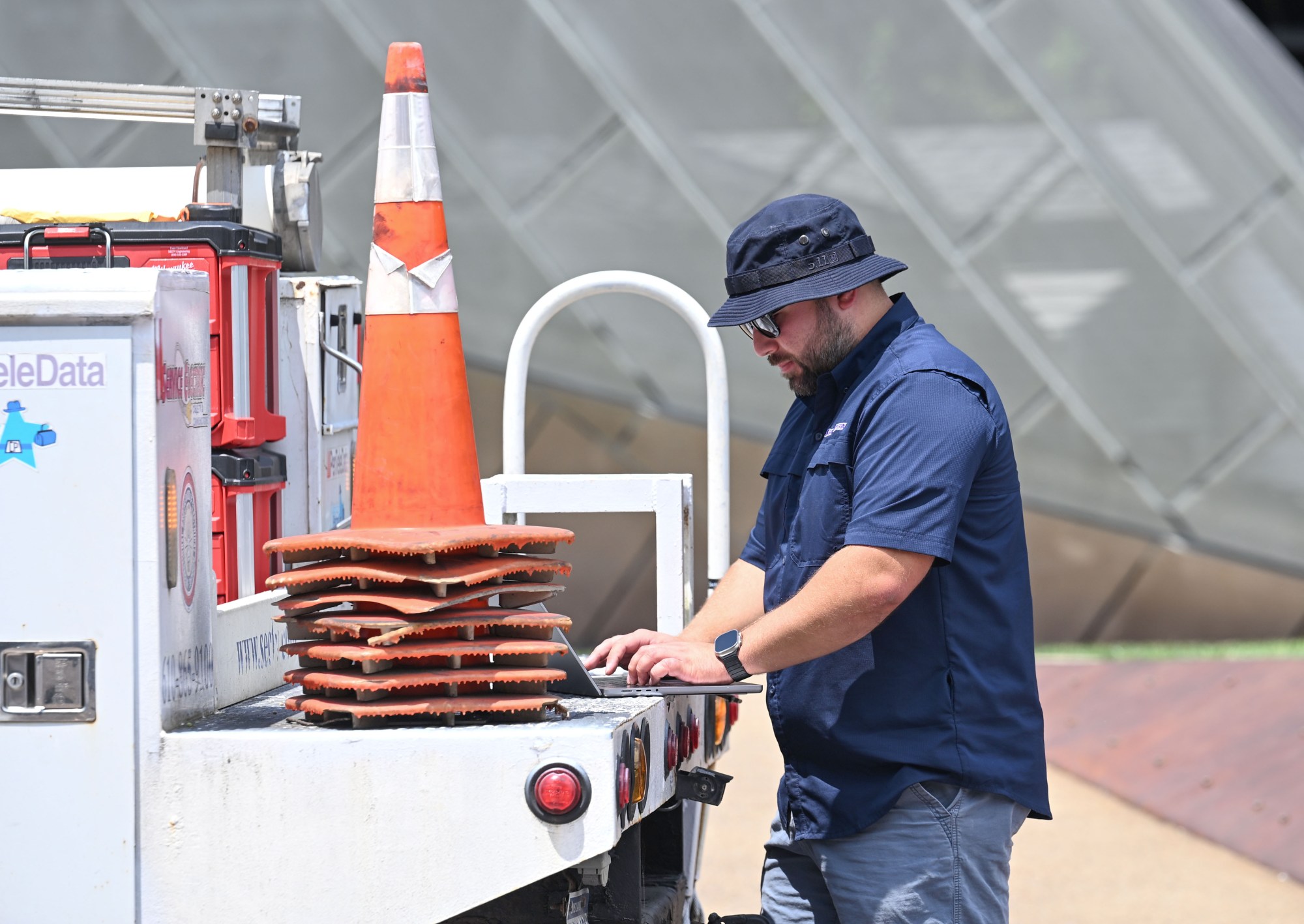 Maxwell Paine, an engineer with Service Electric, works on a computer while assisting with preparations for Musikfest on Wednesday, July 22, 2026, in Bethlehem. The 10-day, free music festival in both North and South Side Bethlehem runs July 31-Aug. 9. (Jon Chiu/The Morning Call)
