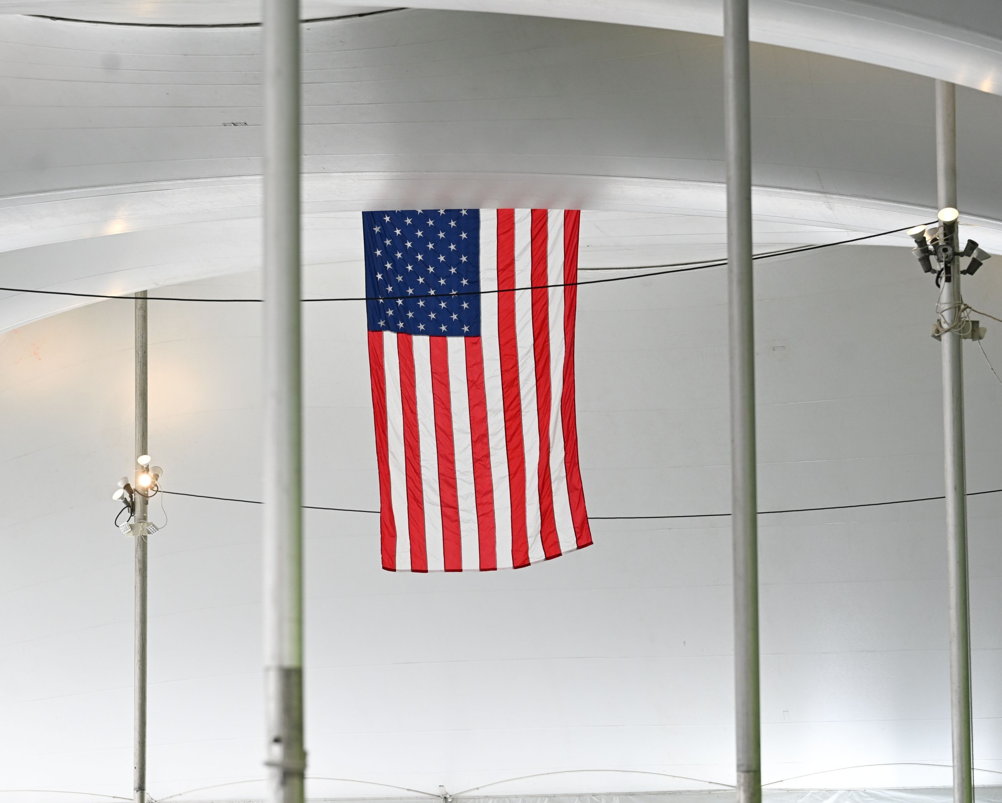An American flag hangs from a tent set up for Musikfest on Wednesday, July 22, 2026, in Bethlehem. The 10-day, free music festival in both North and South Side Bethlehem runs July 31-Aug. 9. (Jon Chiu/The Morning Call)