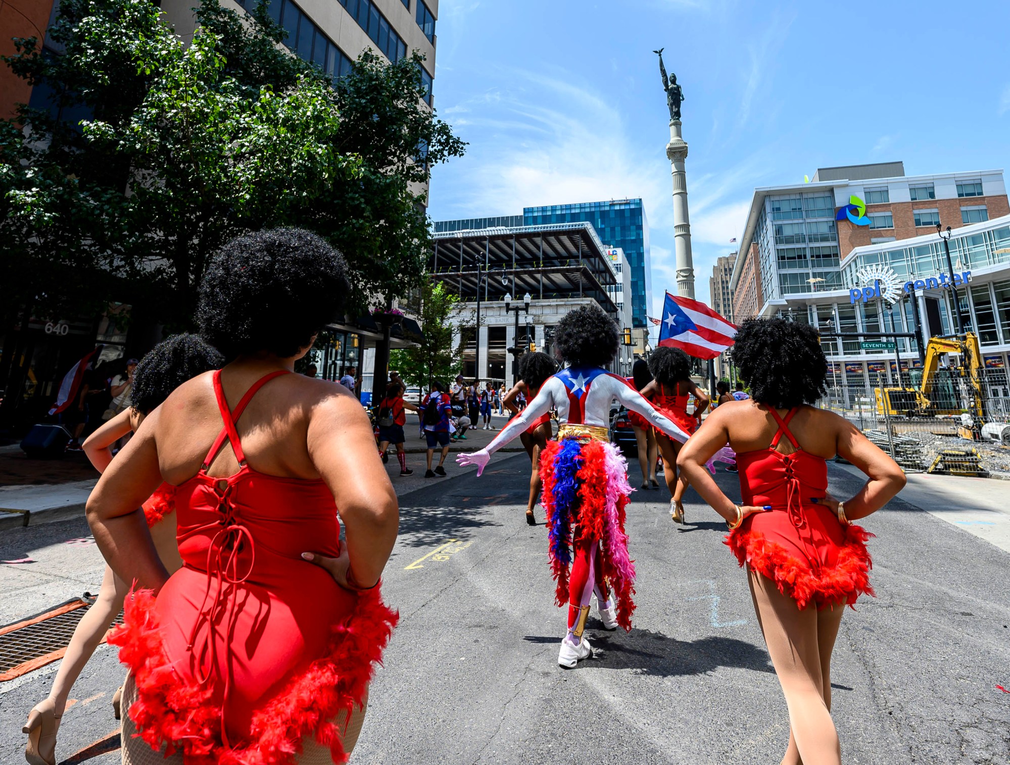 People celebrate during the annual Lehigh Valley Puerto Rican Day Parade on Sunday, July 19, 2026, in Allentown. The day's festivities, sponsored by Puertorrican Cultural Preservation, also included raising the Puerto Rican flag and a festival. (April Gamiz/The Morning Call)