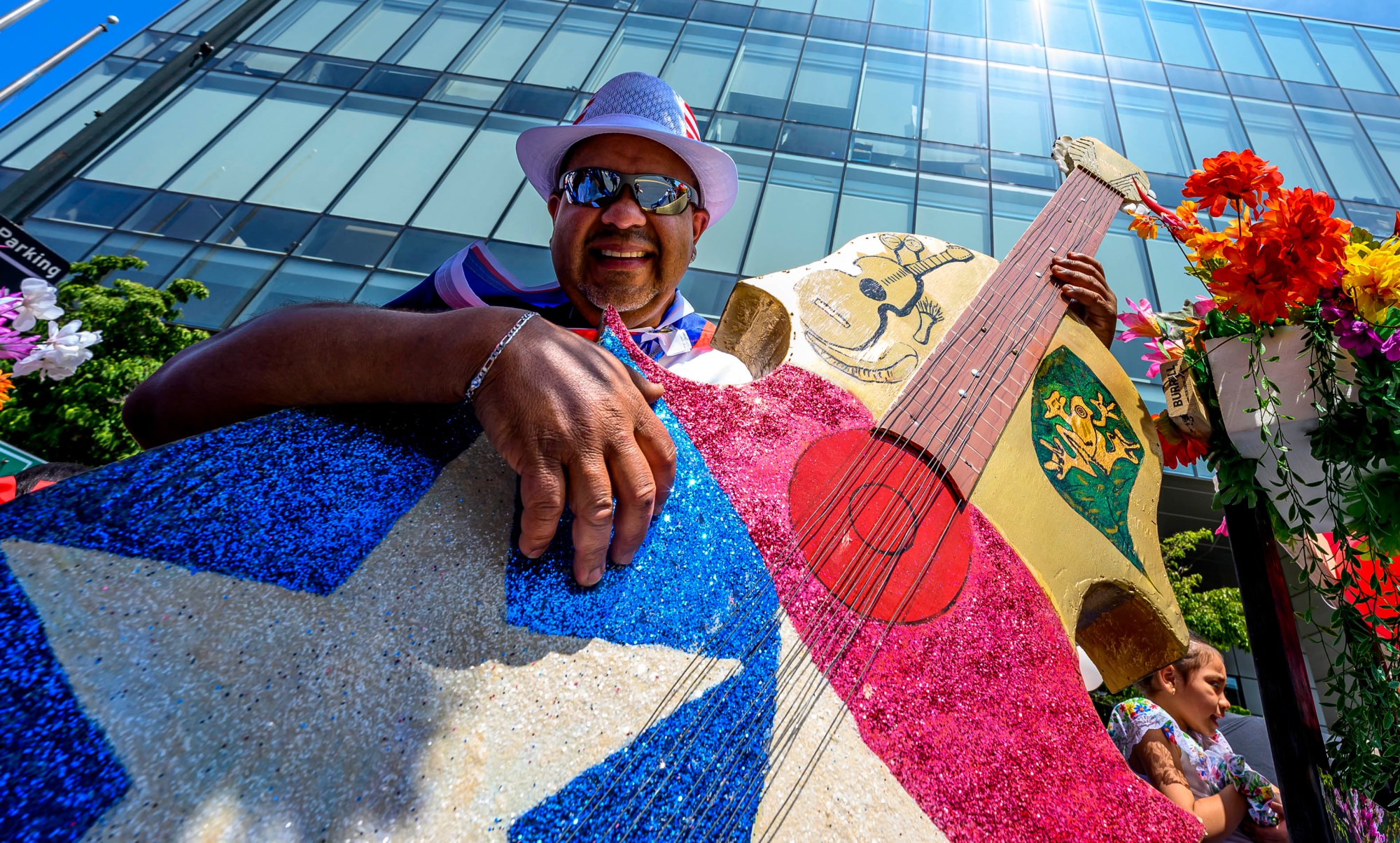 Carlos Fuentes plays a guitar on the Casa Guadalupe Center float during the annual Lehigh Valley Puerto Rican Day Parade on Sunday, July 19, 2026, in Allentown. The day's festivities, sponsored by Puertorrican Cultural Preservation, also included raising the Puerto Rican flag and a festival. (April Gamiz/The Morning Call)
