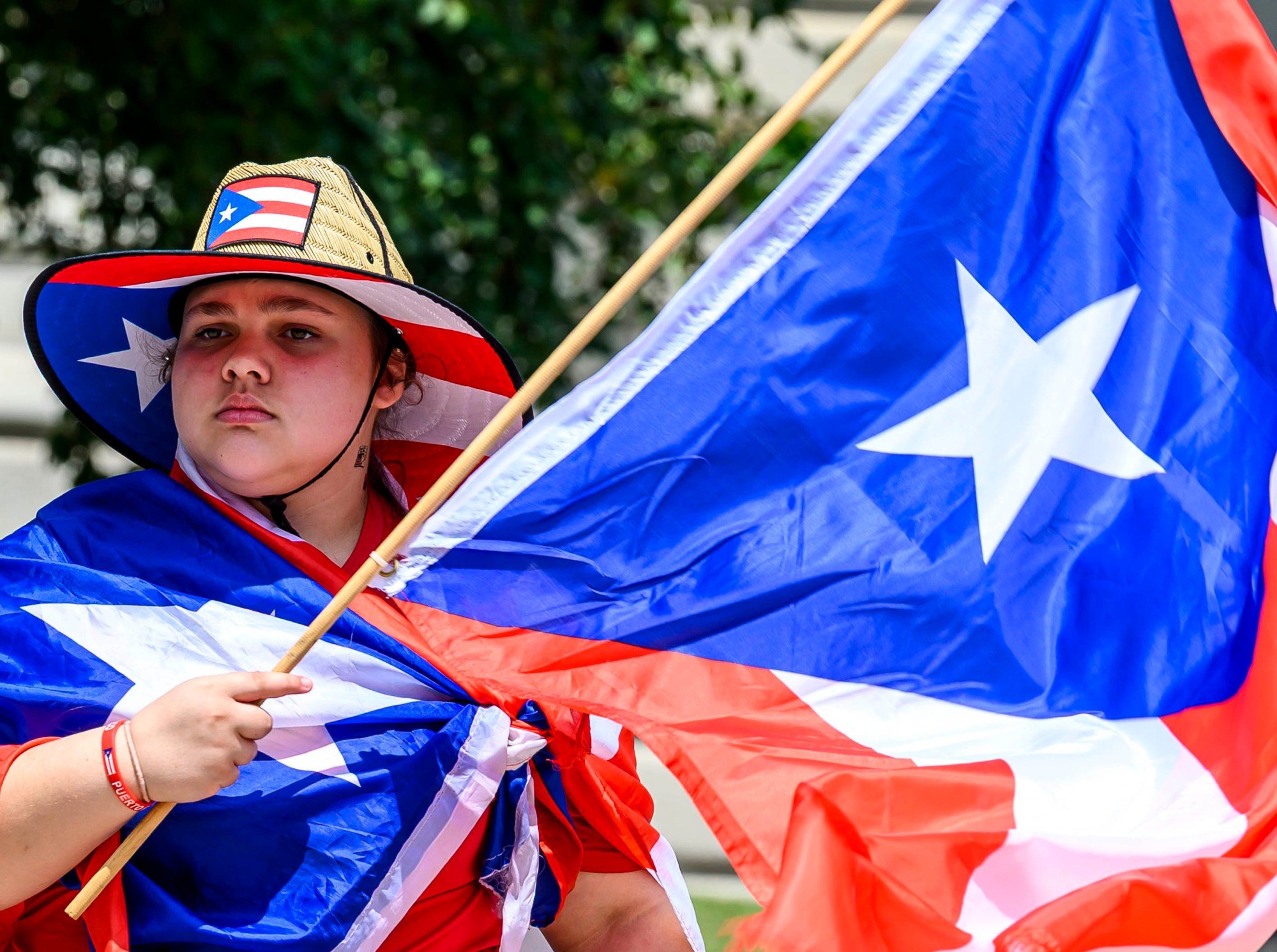 Alena Pizarro, 14, celebrates during the annual Lehigh Valley Puerto Rican Day Parade on Sunday, July 19, 2026, in Allentown. The day's festivities, sponsored by Puertorrican Cultural Preservation, also included raising the Puerto Rican flag and a festival. (April Gamiz/The Morning Call)