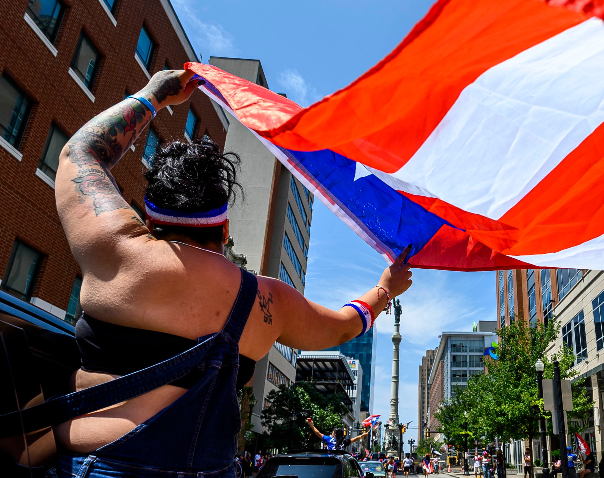 People celebrate during the annual Lehigh Valley Puerto Rican Day Parade on Sunday, July 19, 2026, in Allentown. The day's festivities, sponsored by Puertorrican Cultural Preservation, also included raising the Puerto Rican flag and a festival. (April Gamiz/The Morning Call)