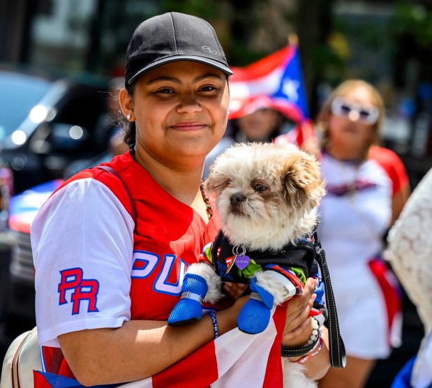 People celebrate during the annual Lehigh Valley Puerto Rican Day Parade on Sunday, July 19, 2026, in Allentown. The day's festivities, sponsored by Puertorrican Cultural Preservation, also included raising the Puerto Rican flag and a festival. (April Gamiz/The Morning Call)