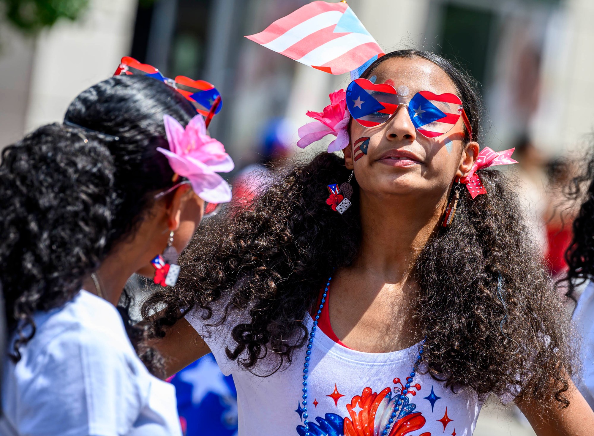 People celebrate during the annual Lehigh Valley Puerto Rican Day Parade on Sunday, July 19, 2026, in Allentown. The day's festivities, sponsored by Puertorrican Cultural Preservation, also included raising the Puerto Rican flag and a festival. (April Gamiz/The Morning Call)