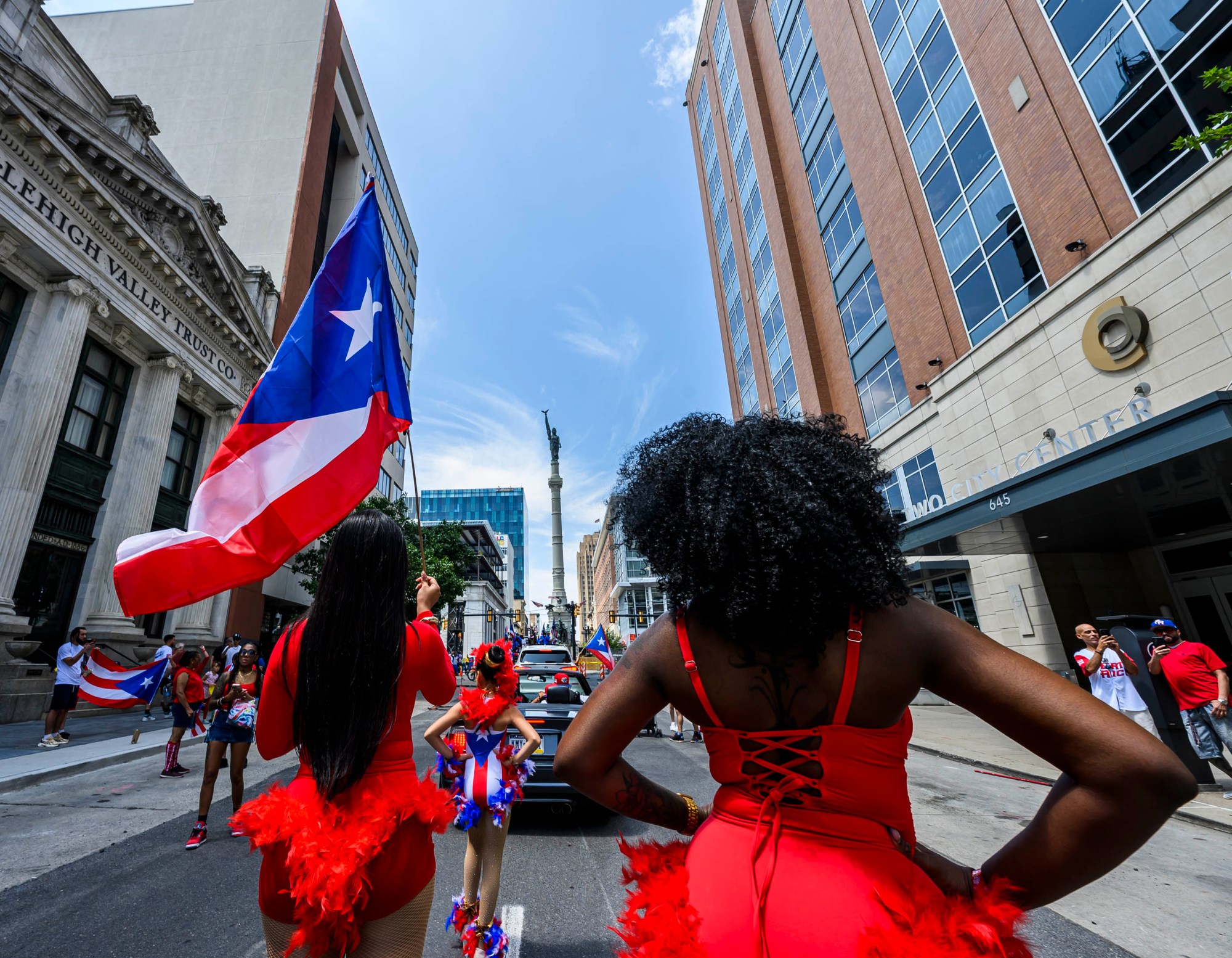 People celebrate during the annual Lehigh Valley Puerto Rican Day Parade on Sunday, July 19, 2026, in Allentown. The day's festivities, sponsored by Puertorrican Cultural Preservation, also included raising the Puerto Rican flag and a festival. (April Gamiz/The Morning Call)