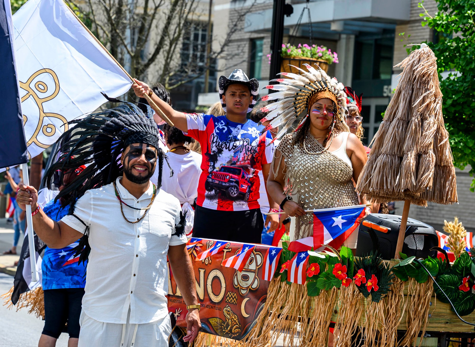 People celebrate during the annual Lehigh Valley Puerto Rican Day Parade on Sunday, July 19, 2026, in Allentown. The day's festivities, sponsored by Puertorrican Cultural Preservation, also included raising the Puerto Rican flag and a festival. (April Gamiz/The Morning Call)