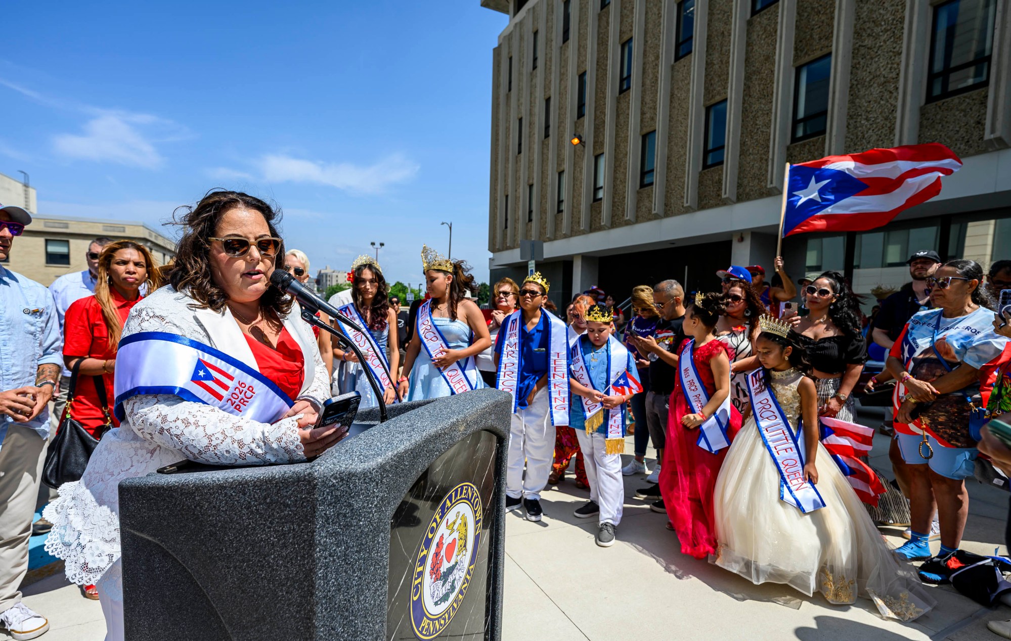 Grand Marshal Jennifer Ramos speaks during the raising of the Puerto Rican flag before the annual Lehigh Valley Puerto Rican Day Parade and Festival on Sunday, July 19, 2026, in Allentown. The day's festivities were sponsored by Puertorrican Cultural Preservation. (April Gamiz/The Morning Call)