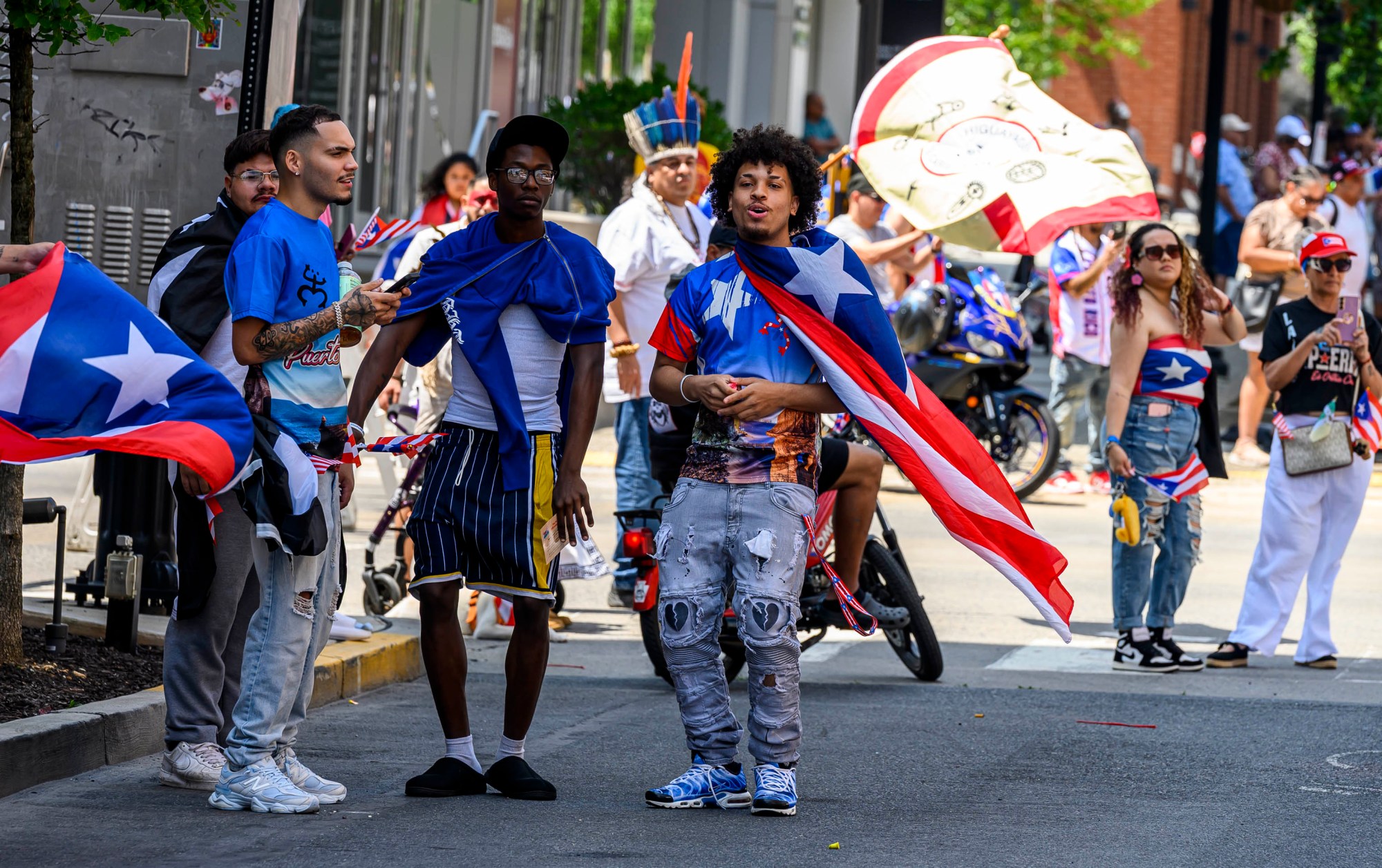People celebrate during the annual Lehigh Valley Puerto Rican Day Parade on Sunday, July 19, 2026, in Allentown. The day's festivities, sponsored by Puertorrican Cultural Preservation, also included raising the Puerto Rican flag and a festival. (April Gamiz/The Morning Call)