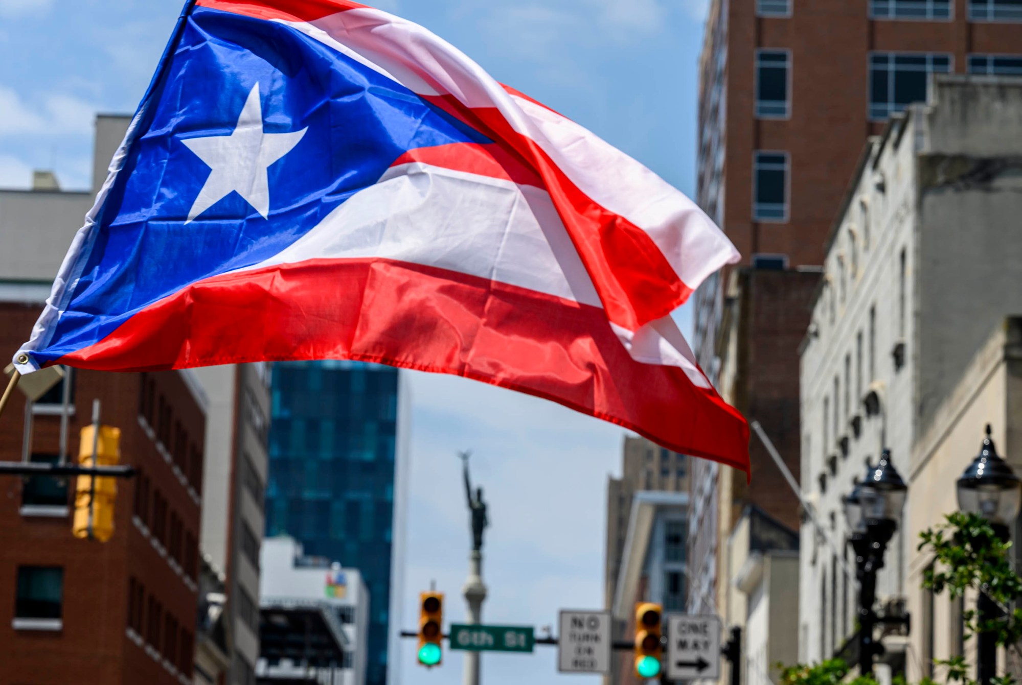 People celebrate during the annual Lehigh Valley Puerto Rican Day Parade on Sunday, July 19, 2026, in Allentown. The day's festivities, sponsored by Puertorrican Cultural Preservation, also included raising the Puerto Rican flag and a festival. (April Gamiz/The Morning Call)