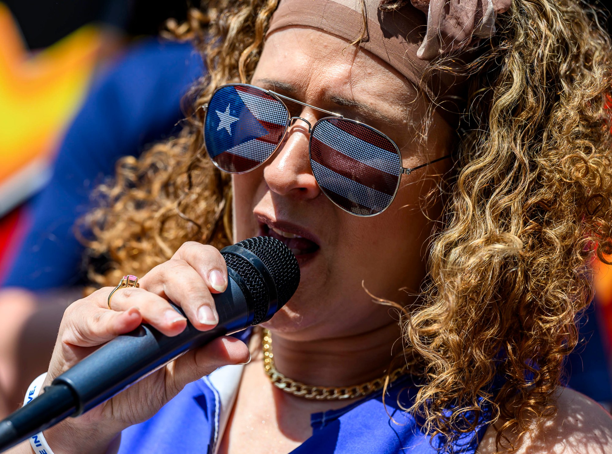 Uni Lopez sings the U.S. national anthem during the raising of the Puerto Rican flag before the annual Lehigh Valley Puerto Rican Day Parade and Festival on Sunday, July 19, 2026, in Allentown. The day's festivities were sponsored by Puertorrican Cultural Preservation. (April Gamiz/The Morning Call)