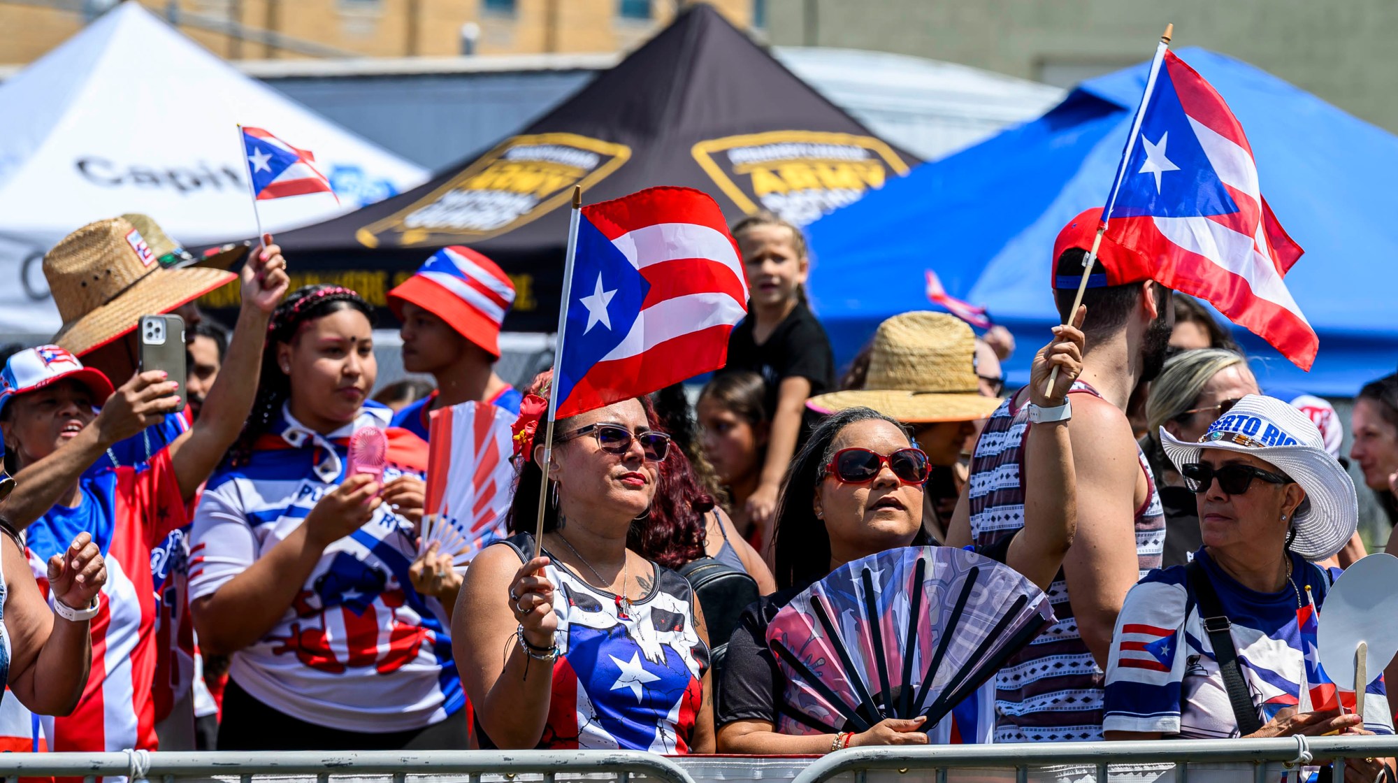 People celebrate during the annual Lehigh Valley Puerto Rican Day Festival on Sunday, July 19, 2026, at the Allentown Fairgrounds. The day's festivities, sponsored by Puertorrican Cultural Preservation, also included raising the Puerto Rican flag and a parade. (April Gamiz/The Morning Call)