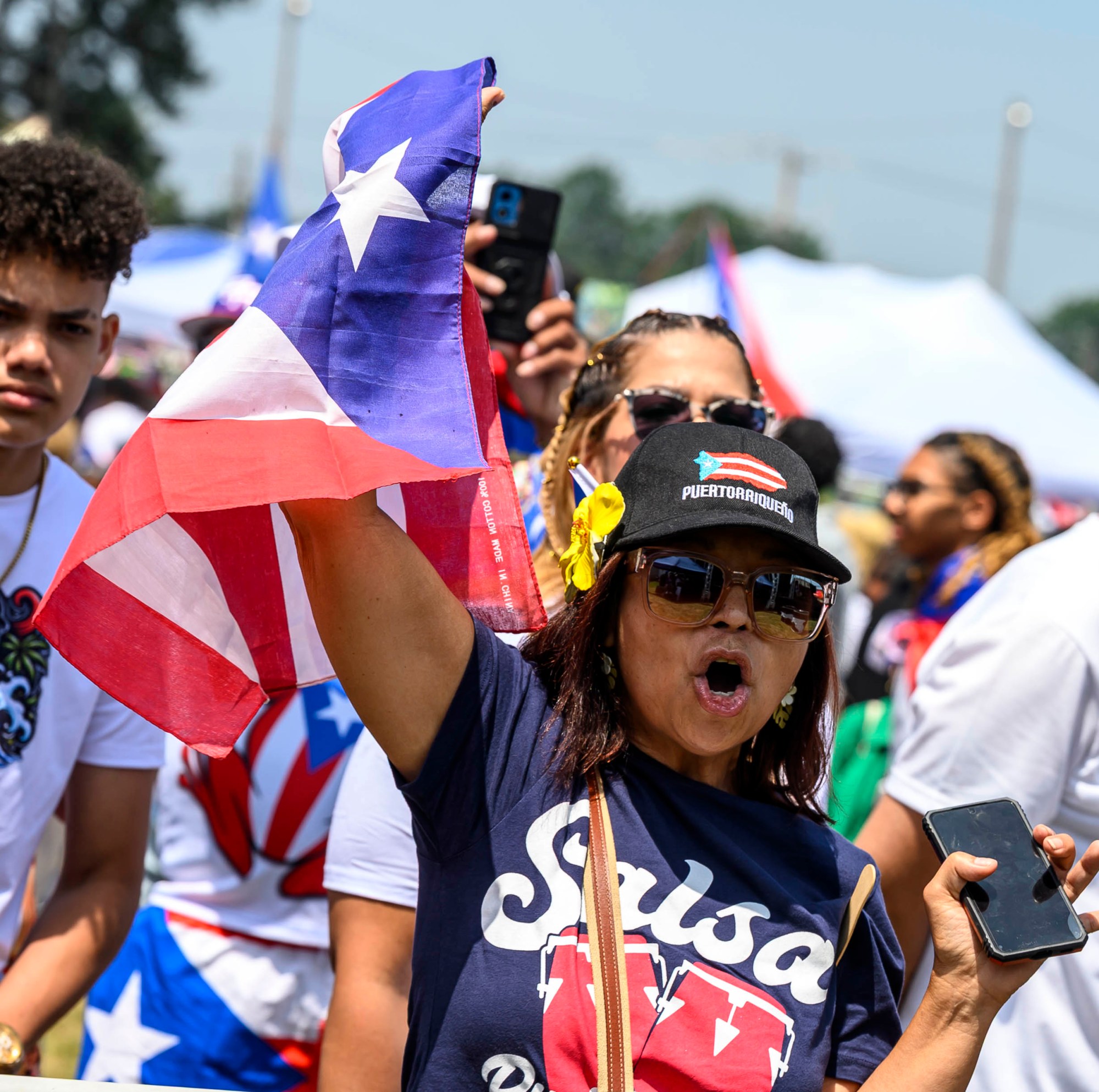 People celebrate during the annual Lehigh Valley Puerto Rican Day Festival on Sunday, July 19, 2026, at the Allentown Fairgrounds. The day's festivities, sponsored by Puertorrican Cultural Preservation, also included raising the Puerto Rican flag and a parade. (April Gamiz/The Morning Call)