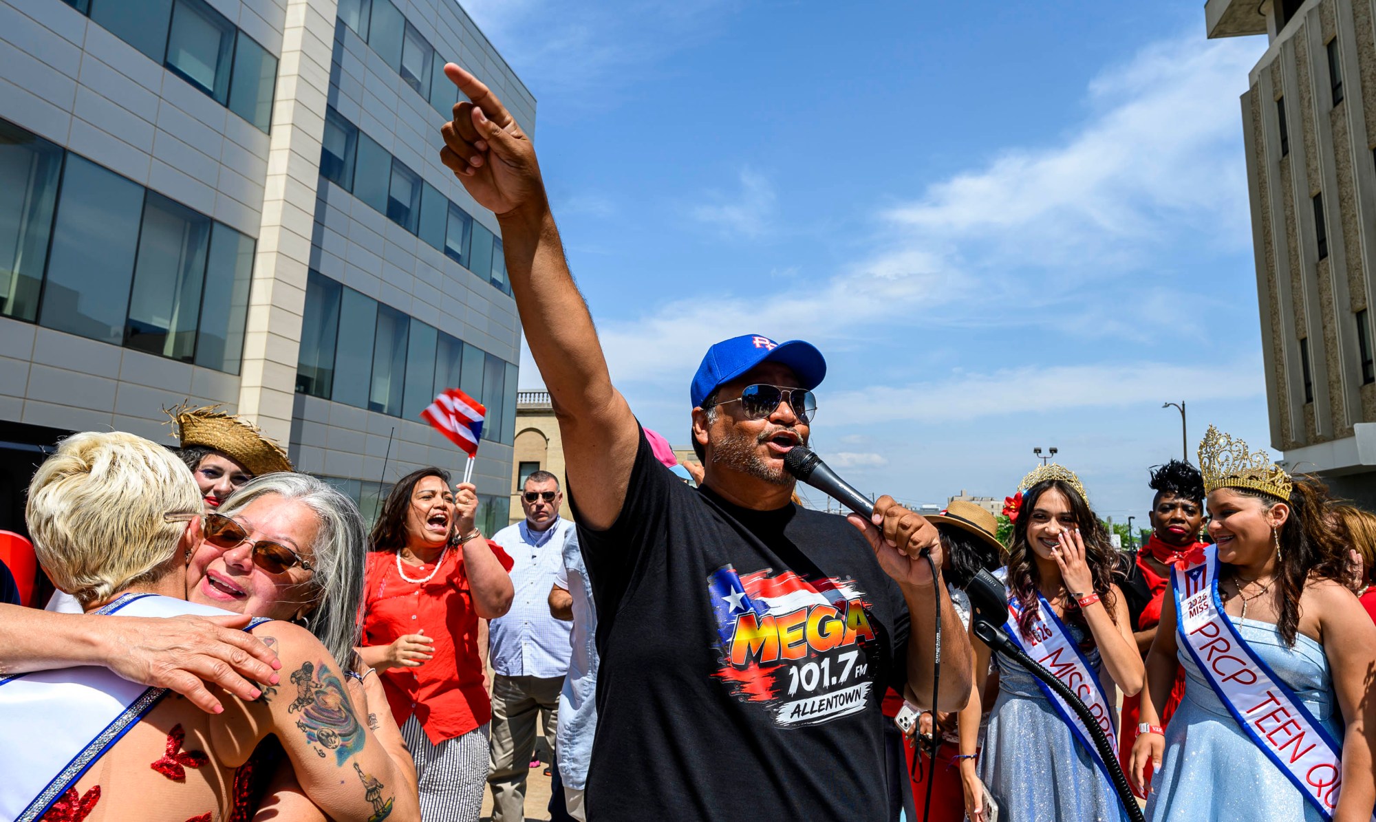 Master of Ceremonies Victor Martinez, owner of La Mega radio station, welcomes the crowd during the raising of the Puerto Rican flag before the annual Lehigh Valley Puerto Rican Day Parade and Festival on Sunday, July 19, 2026, in Allentown. The day's festivities were sponsored by Puertorrican Cultural Preservation. (April Gamiz/The Morning Call)