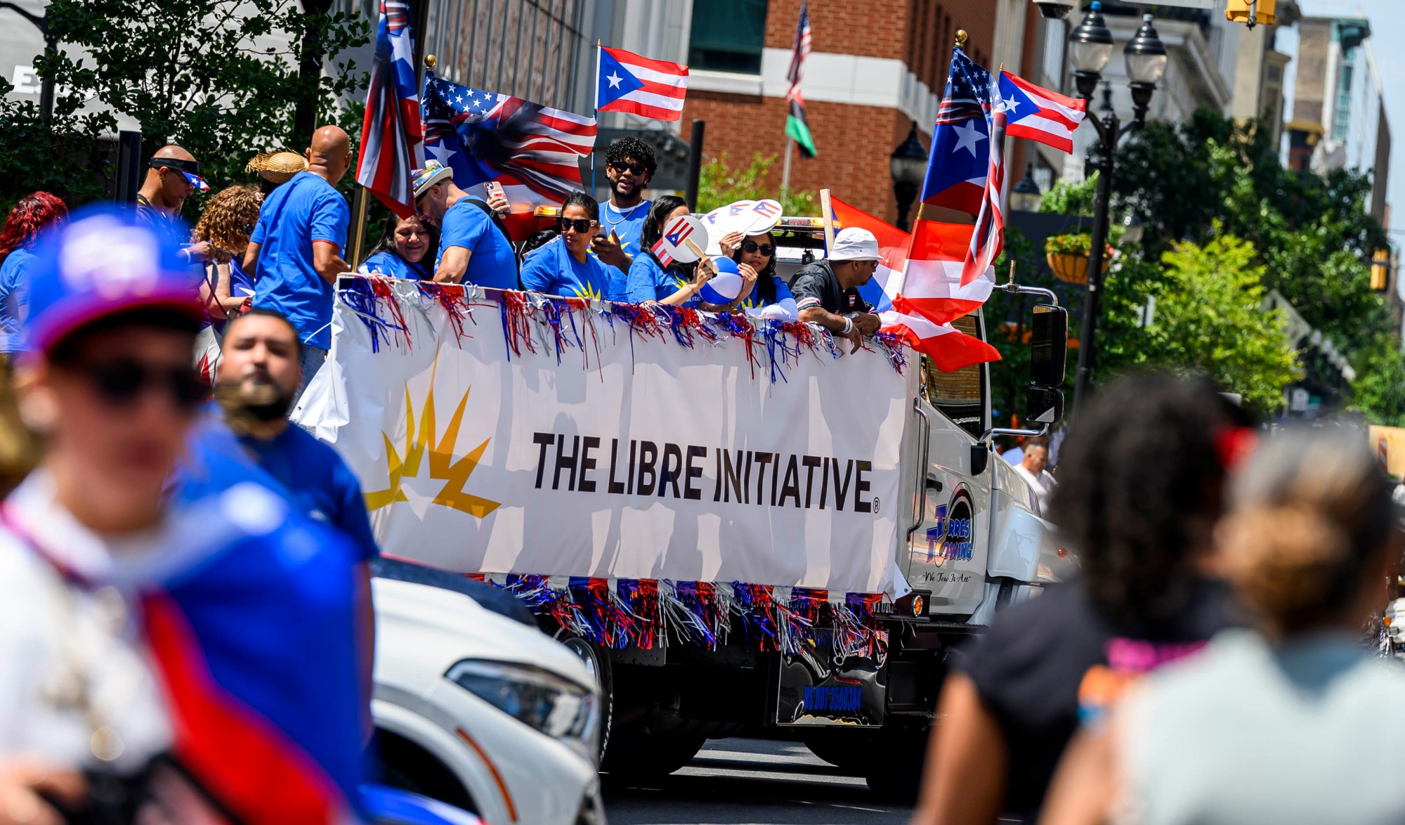 People celebrate during the annual Lehigh Valley Puerto Rican Day Parade on Sunday, July 19, 2026, in Allentown. The day's festivities, sponsored by Puertorrican Cultural Preservation, also included raising the Puerto Rican flag and a festival. (April Gamiz/The Morning Call)
