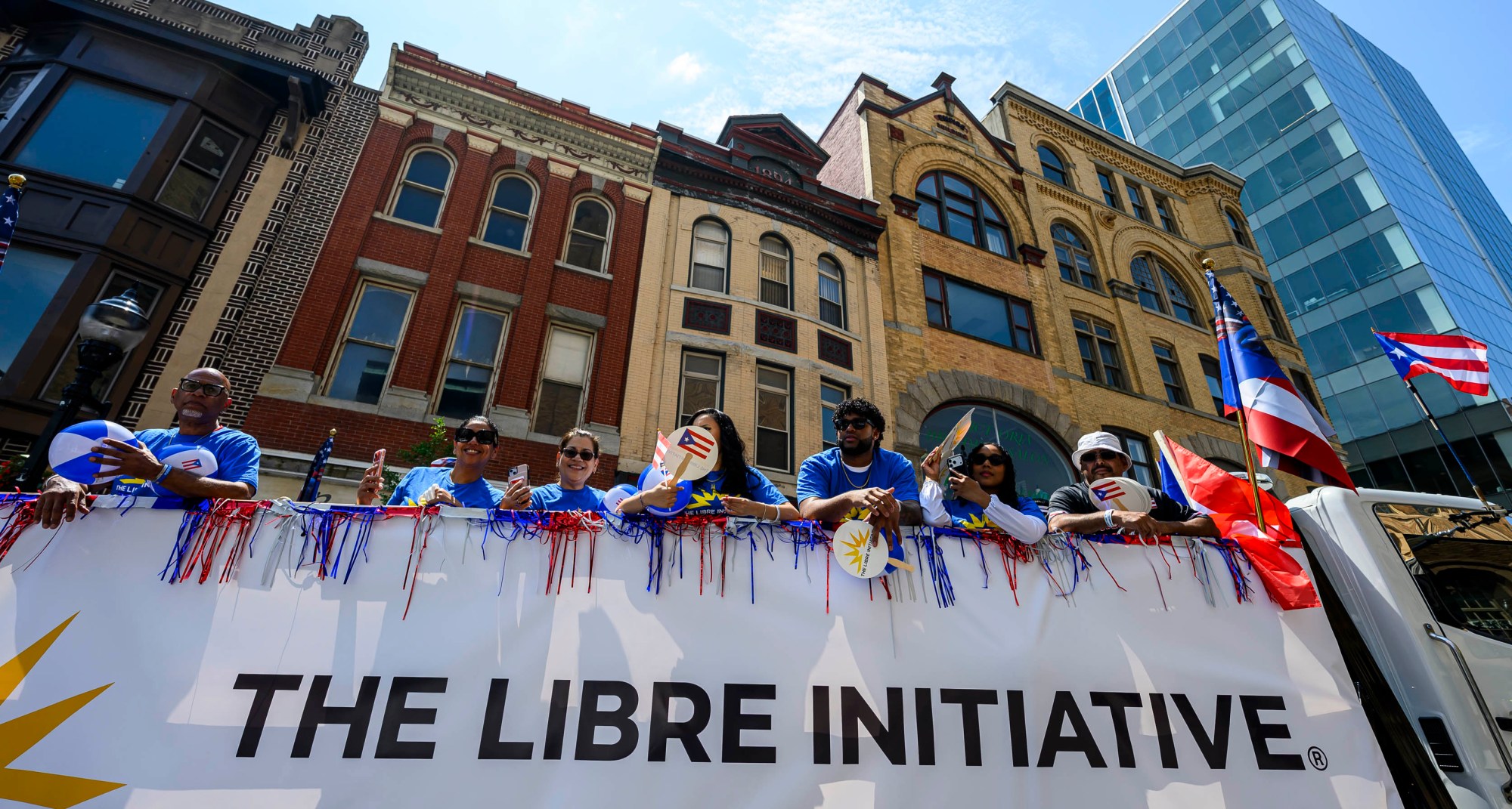 People celebrate during the annual Lehigh Valley Puerto Rican Day Parade on Sunday, July 19, 2026, in Allentown. The day's festivities, sponsored by Puertorrican Cultural Preservation, also included raising the Puerto Rican flag and a festival. (April Gamiz/The Morning Call)