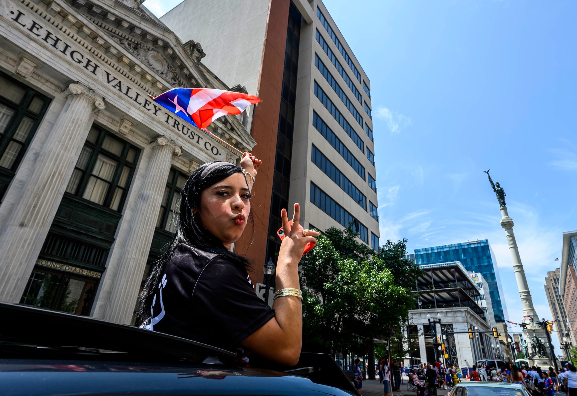 People celebrate during the annual Lehigh Valley Puerto Rican Day Parade on Sunday, July 19, 2026, in Allentown. The day's festivities, sponsored by Puertorrican Cultural Preservation, also included raising the Puerto Rican flag and a festival. (April Gamiz/The Morning Call)