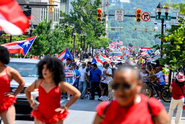 People celebrate during the annual Lehigh Valley Puerto Rican Day Parade on Sunday, July 19, 2026, in Allentown. The day's festivities, sponsored by Puertorrican Cultural Preservation, also included raising the Puerto Rican flag and a festival. (April Gamiz/The Morning Call)