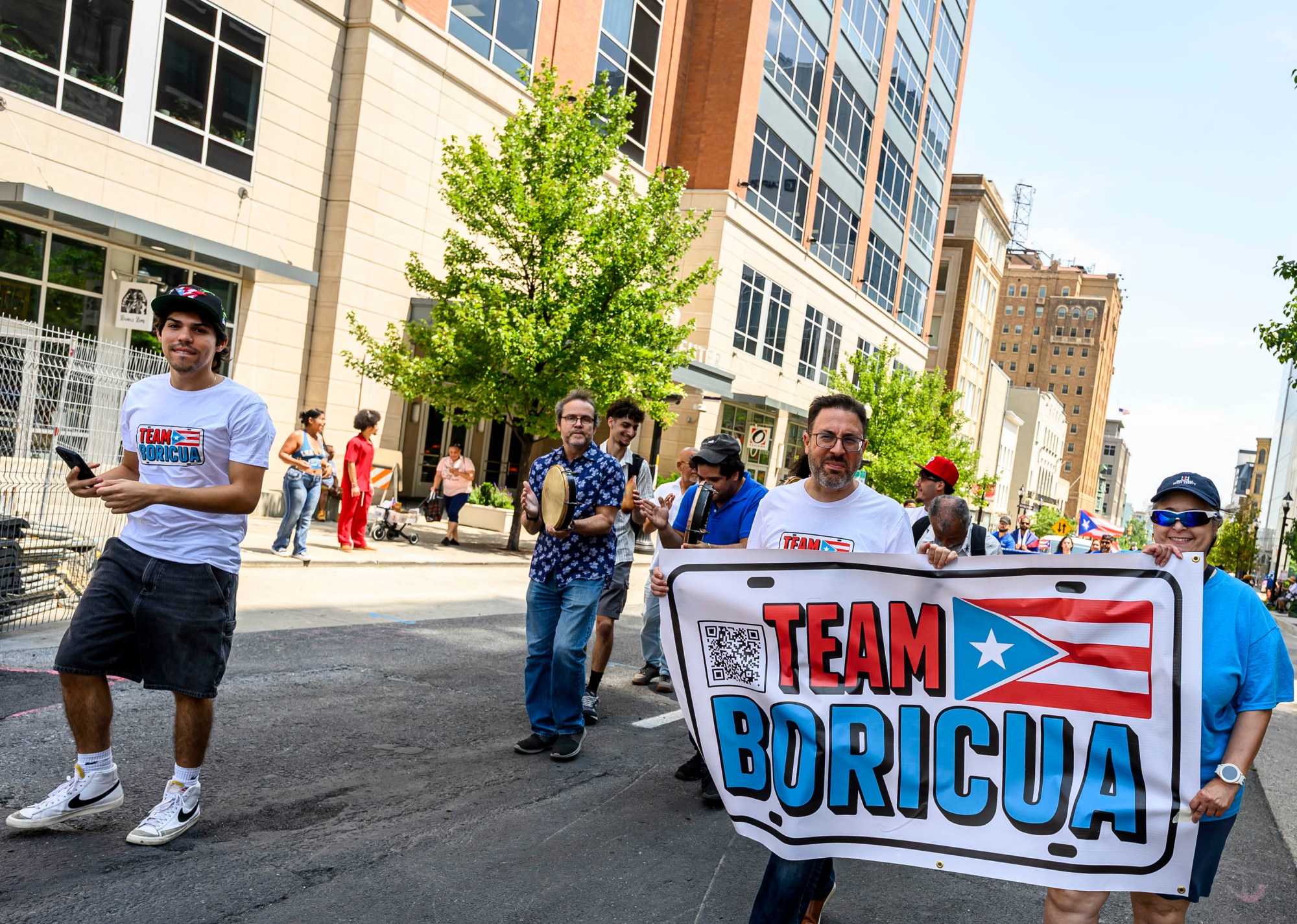 People celebrate during the annual Lehigh Valley Puerto Rican Day Parade on Sunday, July 19, 2026, in Allentown. The day's festivities, sponsored by Puertorrican Cultural Preservation, also included raising the Puerto Rican flag and a festival. (April Gamiz/The Morning Call)