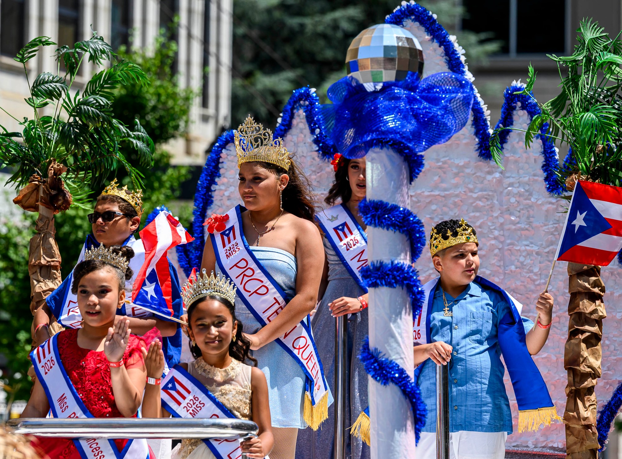 People celebrate during the annual Lehigh Valley Puerto Rican Day Parade on Sunday, July 19, 2026, in Allentown. The day's festivities, sponsored by Puertorrican Cultural Preservation, also included raising the Puerto Rican flag and a festival. (April Gamiz/The Morning Call)