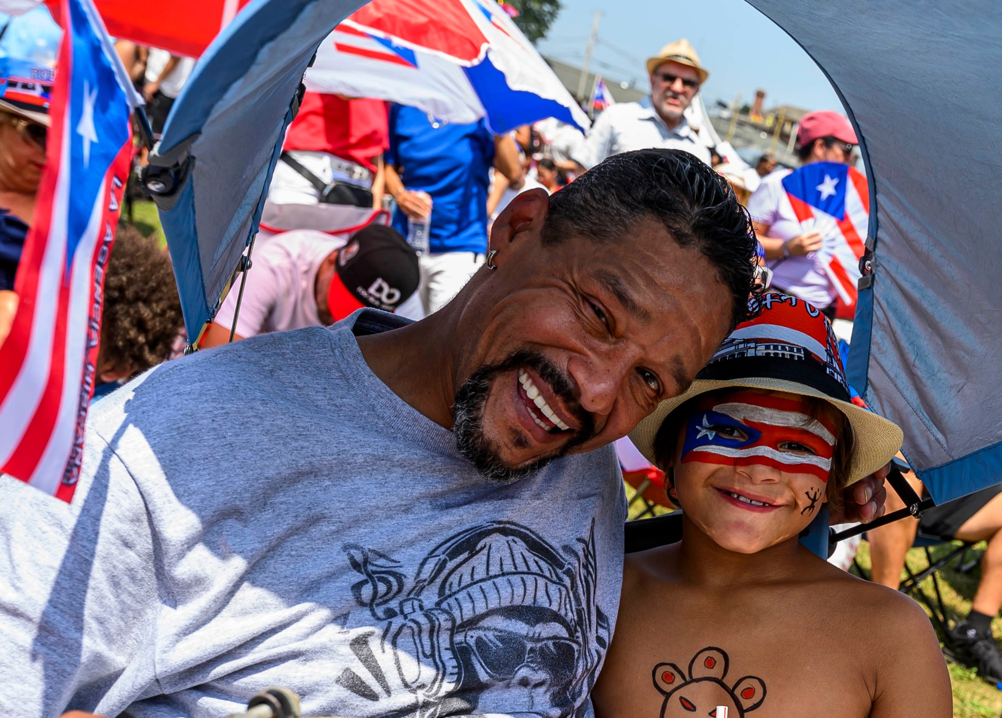 People celebrate during the annual Lehigh Valley Puerto Rican Day Festival on Sunday, July 19, 2026, at the Allentown Fairgrounds. The day's festivities, sponsored by Puertorrican Cultural Preservation, also included raising the Puerto Rican flag and a parade. (April Gamiz/The Morning Call)