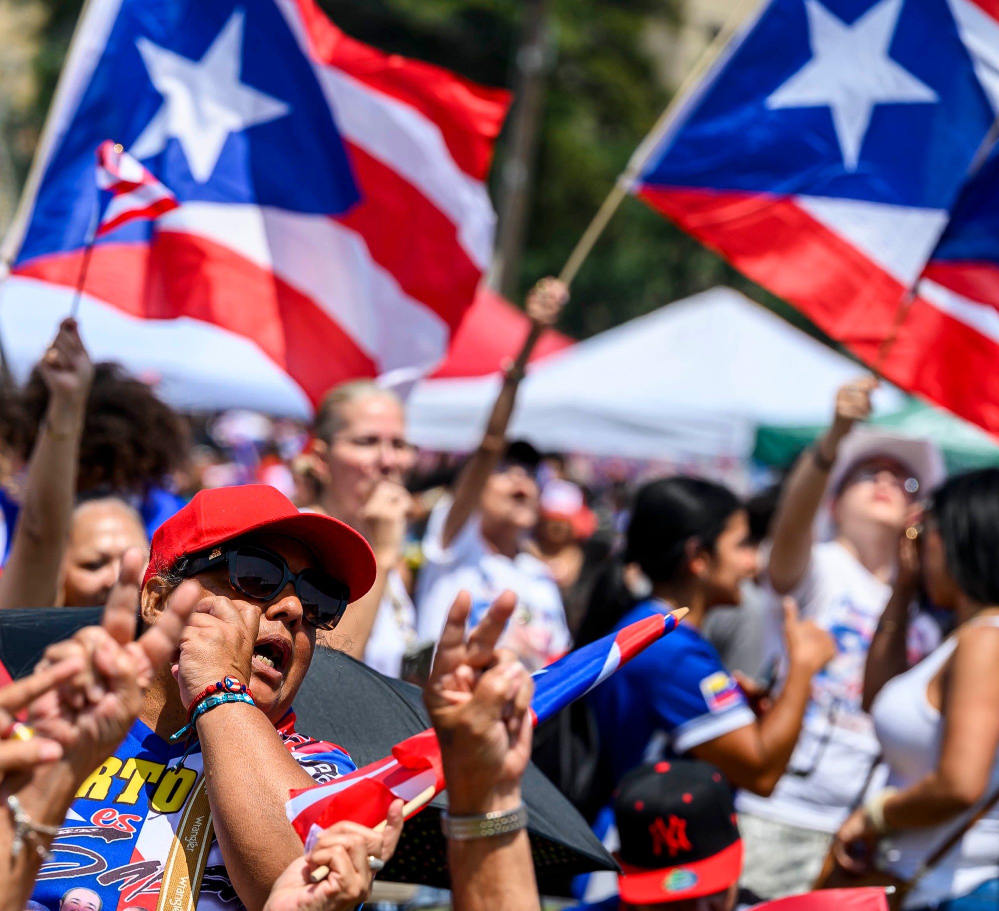 People celebrate during the annual Lehigh Valley Puerto Rican Day Festival on Sunday, July 19, 2026, at the Allentown Fairgrounds. The day's festivities, sponsored by Puertorrican Cultural Preservation, also included raising the Puerto Rican flag and a parade. (April Gamiz/The Morning Call)