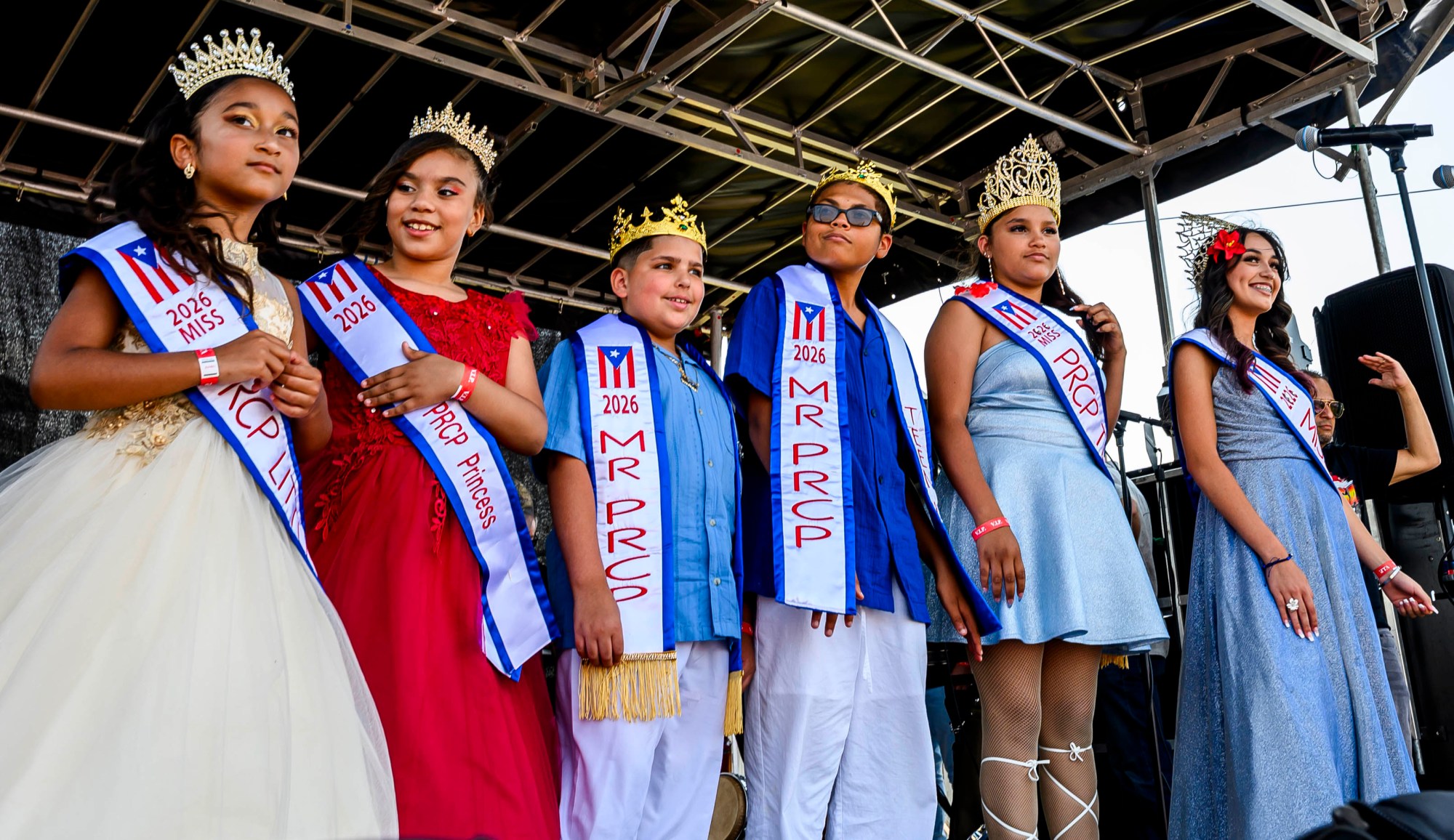 The Puertorrican Cultural Preservation Royal Court stands on the stage during the annual Lehigh Valley Puerto Rican Day Festival on Sunday, July 19, 2026, at the Allentown Fairgrounds. The day's festivities, sponsored by Puertorrican Cultural Preservation, also included raising the Puerto Rican flag and a parade. (April Gamiz/The Morning Call)