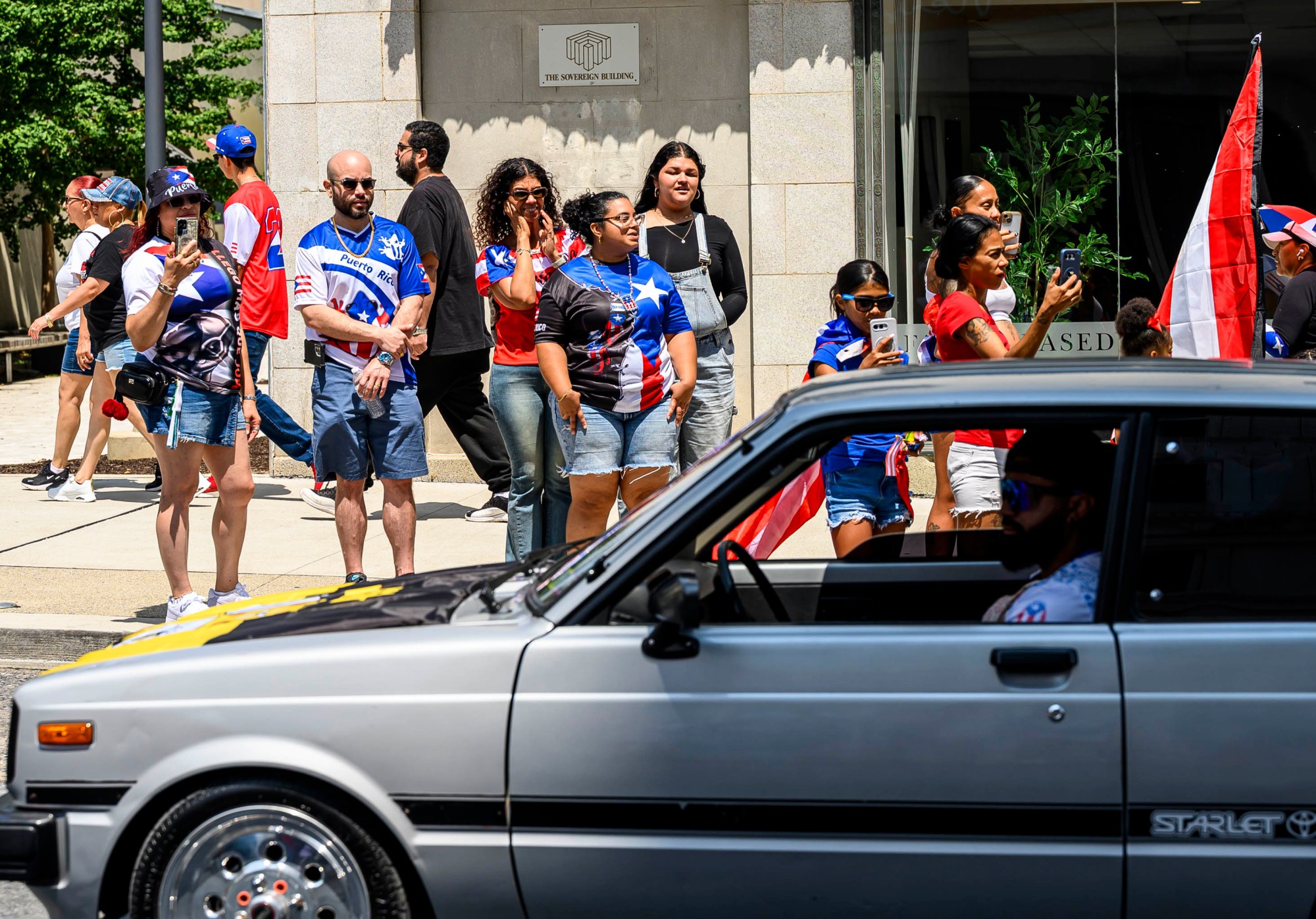 People celebrate during the annual Lehigh Valley Puerto Rican Day Parade on Sunday, July 19, 2026, in Allentown. The day's festivities, sponsored by Puertorrican Cultural Preservation, also included raising the Puerto Rican flag and a festival. (April Gamiz/The Morning Call)