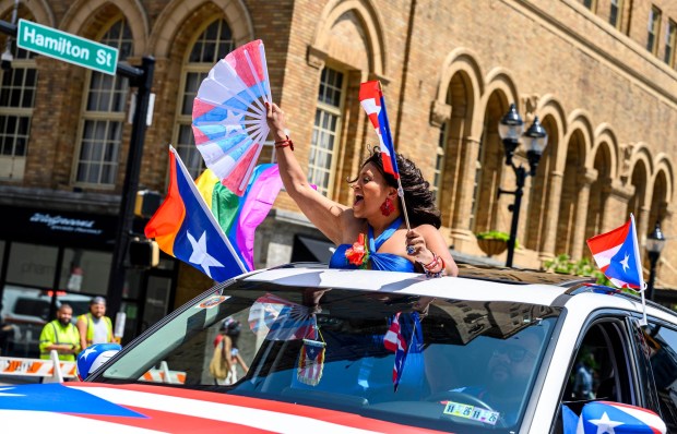 People celebrate during the annual Lehigh Valley Puerto Rican Day Parade on Sunday, July 19, 2026, in Allentown. The day's festivities, sponsored by Puertorrican Cultural Preservation, also included raising the Puerto Rican flag and a festival. (April Gamiz/The Morning Call)