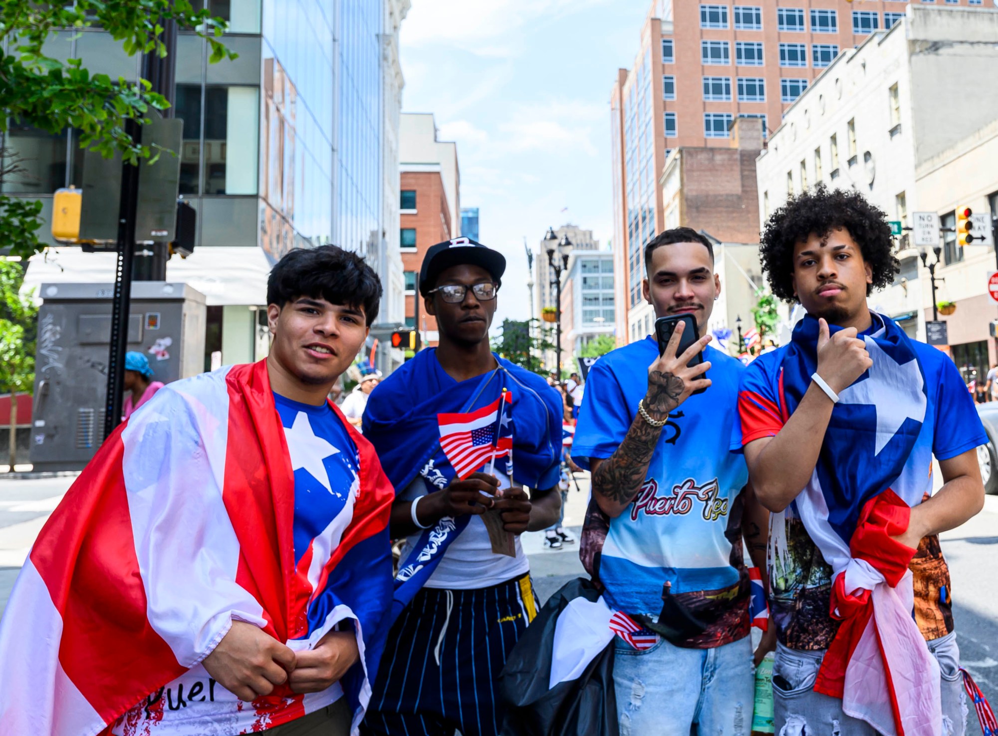 People celebrate during the annual Lehigh Valley Puerto Rican Day Parade on Sunday, July 19, 2026, in Allentown. The day's festivities, sponsored by Puertorrican Cultural Preservation, also included raising the Puerto Rican flag and a festival. (April Gamiz/The Morning Call)