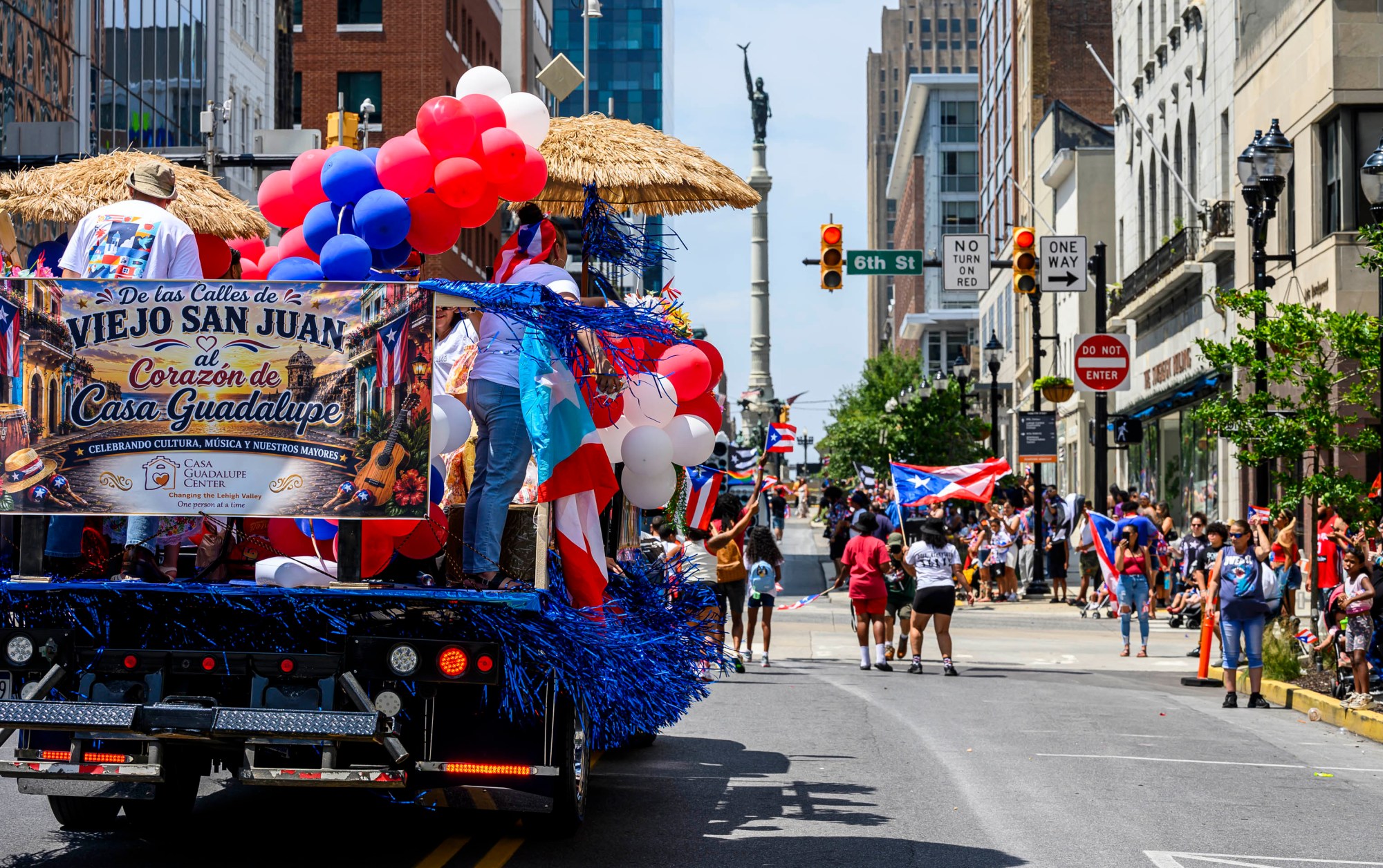 People celebrate during the annual Lehigh Valley Puerto Rican Day Parade on Sunday, July 19, 2026, in Allentown. The day's festivities, sponsored by Puertorrican Cultural Preservation, also included raising the Puerto Rican flag and a festival. (April Gamiz/The Morning Call)