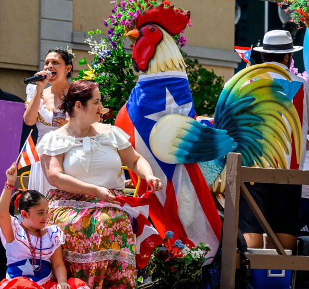 People celebrate during the annual Lehigh Valley Puerto Rican Day Parade on Sunday, July 19, 2026, in Allentown. The day's festivities, sponsored by Puertorrican Cultural Preservation, also included raising the Puerto Rican flag and a festival. (April Gamiz/The Morning Call)