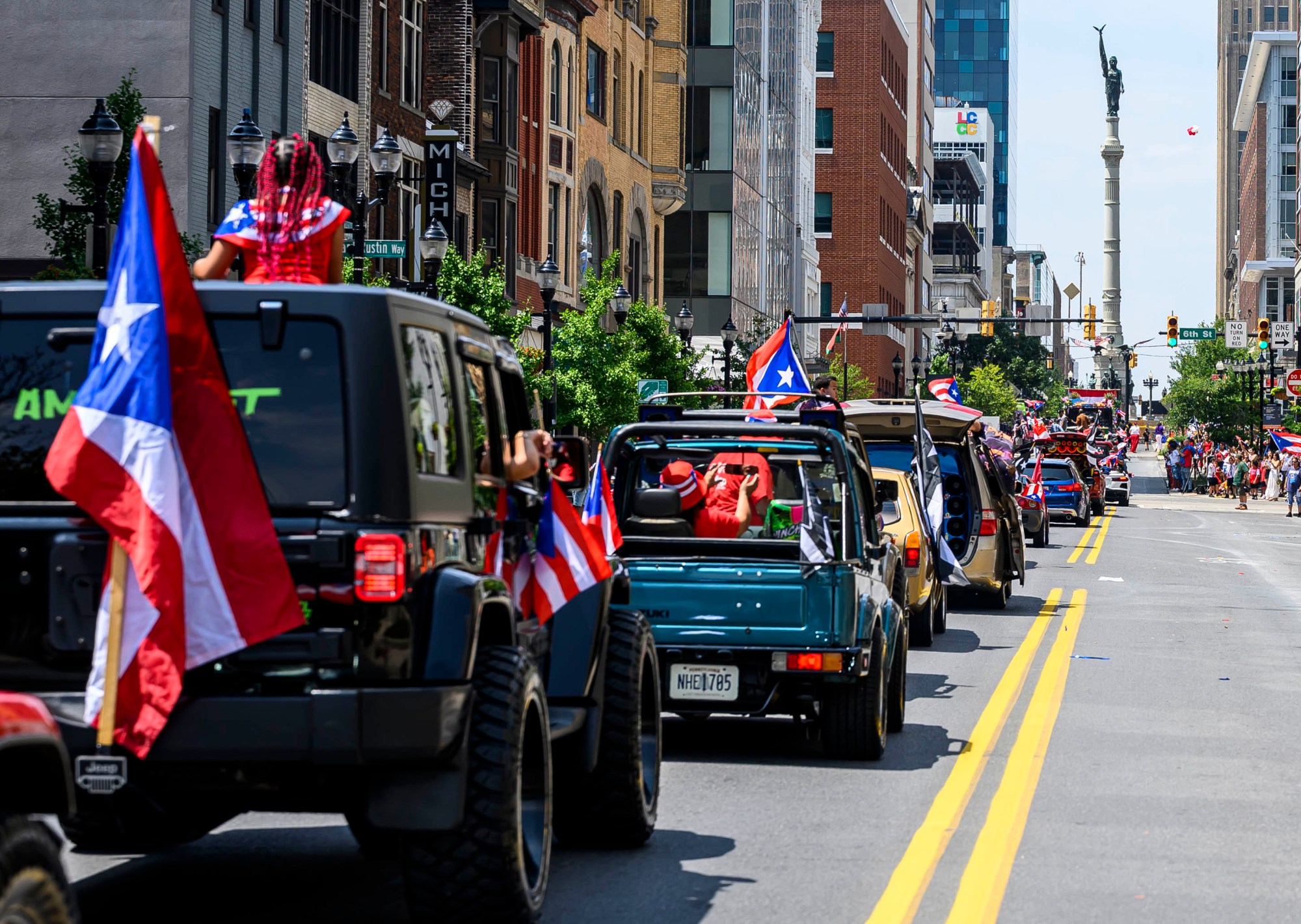 People celebrate during the annual Lehigh Valley Puerto Rican Day Parade on Sunday, July 19, 2026, in Allentown. The day's festivities, sponsored by Puertorrican Cultural Preservation, also included raising the Puerto Rican flag and a festival. (April Gamiz/The Morning Call)