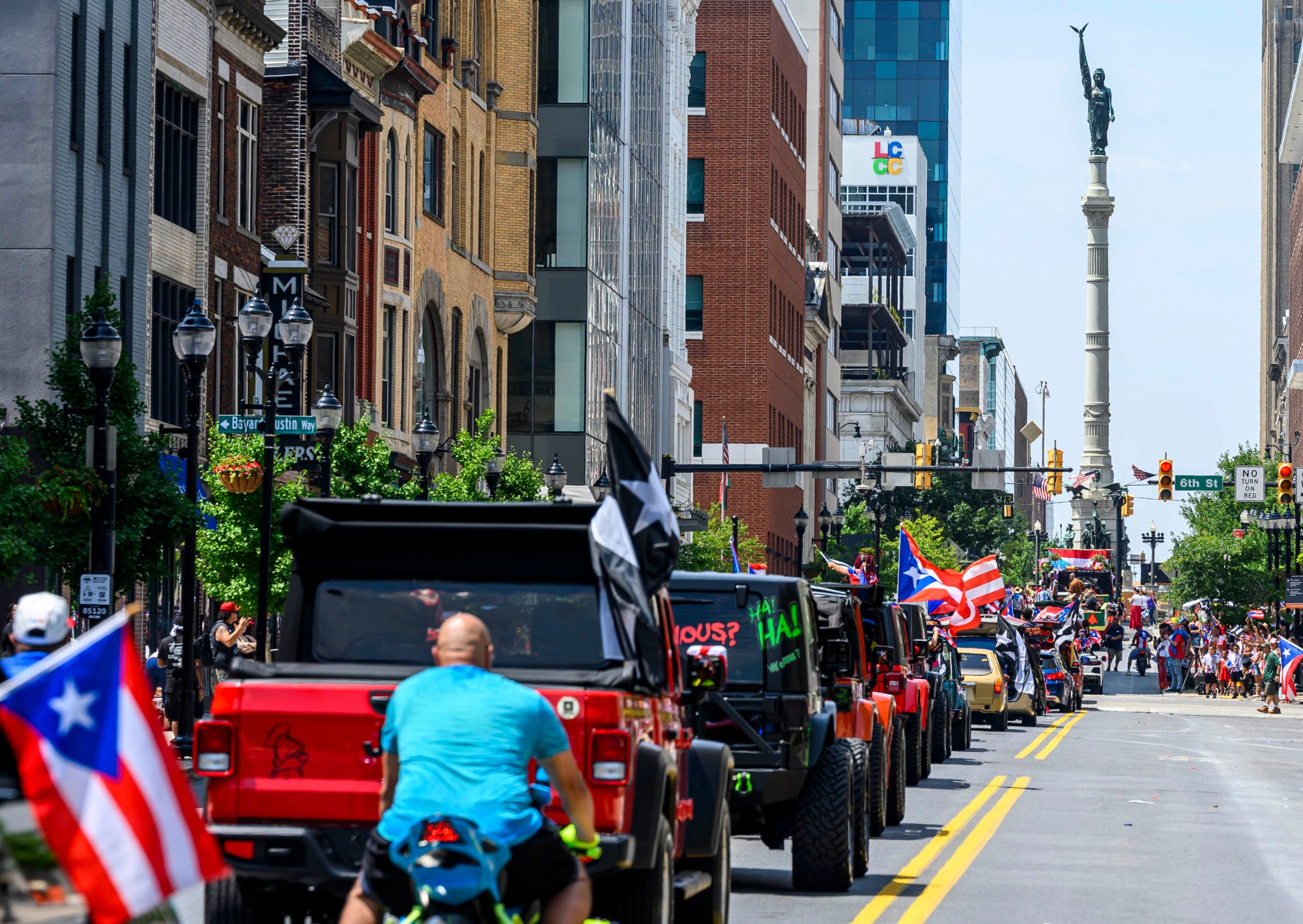 People celebrate during the annual Lehigh Valley Puerto Rican Day Parade on Sunday, July 19, 2026, in Allentown. The day's festivities, sponsored by Puertorrican Cultural Preservation, also included raising the Puerto Rican flag and a festival. (April Gamiz/The Morning Call)