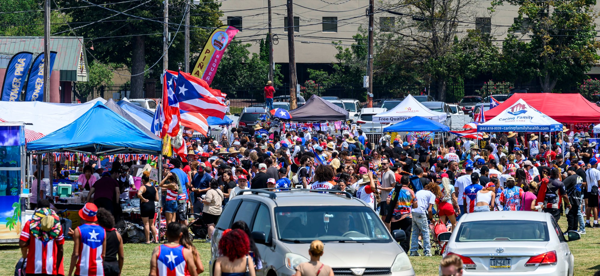 People celebrate during the annual Lehigh Valley Puerto Rican Day Festival on Sunday, July 19, 2026, at the Allentown Fairgrounds. The day's festivities, sponsored by Puertorrican Cultural Preservation, also included raising the Puerto Rican flag and a parade. (April Gamiz/The Morning Call)