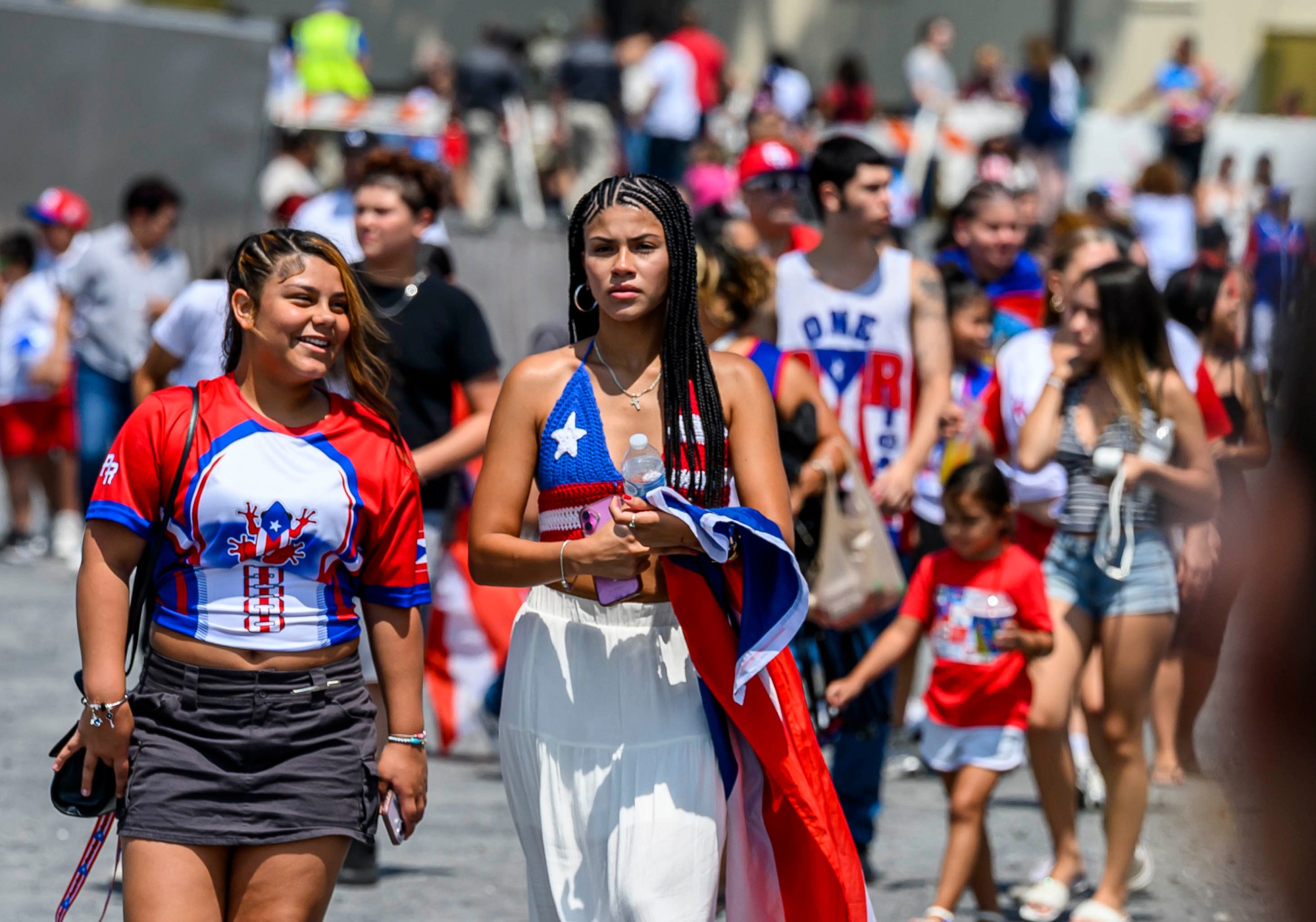 People celebrate during the annual Lehigh Valley Puerto Rican Day Festival on Sunday, July 19, 2026, at the Allentown Fairgrounds. The day's festivities, sponsored by Puertorrican Cultural Preservation, also included raising the Puerto Rican flag and a parade. (April Gamiz/The Morning Call)