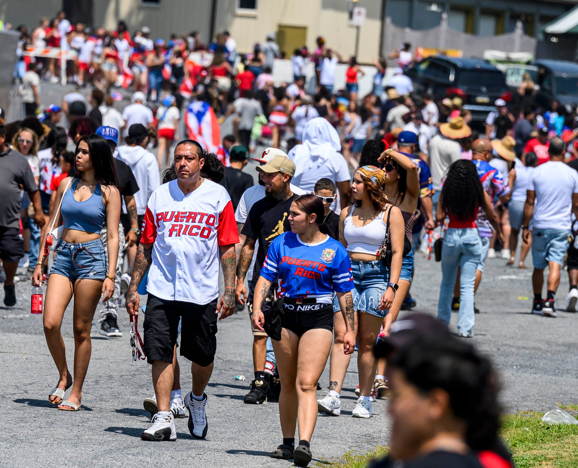 People celebrate during the annual Lehigh Valley Puerto Rican Day Festival on Sunday, July 19, 2026, at the Allentown Fairgrounds. The day's festivities, sponsored by Puertorrican Cultural Preservation, also included raising the Puerto Rican flag and a parade. (April Gamiz/The Morning Call)