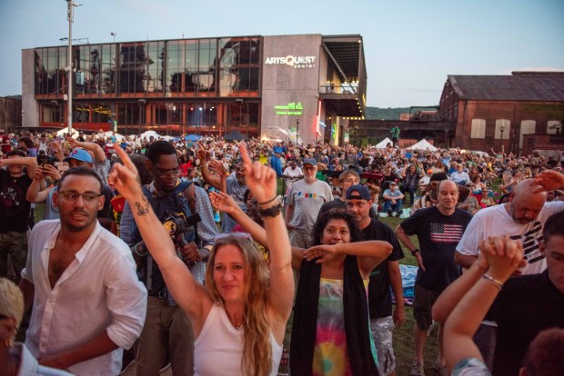 Festivalgoers enjoy the sights and sounds of the One Earth Festival Global Music and Culture Festival at SteelStacks on Saturday July 11 2026. The fifth annual festival, presented by ArtsQuest in partnership with Movement Moves Media, celebrates global music, culture and community. (Jonathan Broady/Special to The Morning Call)