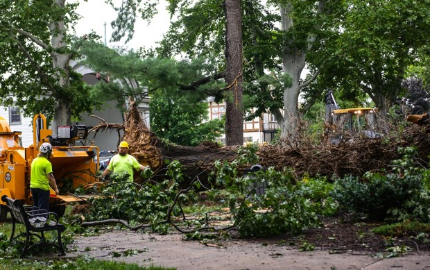 City workers clean fallen trees, limbs and debris Monday, July 6, 2026, at West Park in Allentown. Storms that hit the Lehigh Valley over the weekend caused damage in the park, as well as road closures and power outages throughout the region. (Monica Cabrera/The Morning Call)