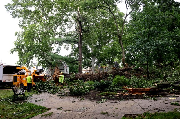 City workers clean fallen trees, limbs and debris Monday, July 6, 2026, at West Park in Allentown. Storms that hit the Lehigh Valley over the weekend caused damage in the park, as well as road closures and power outages throughout the region. (Monica Cabrera/The Morning Call)