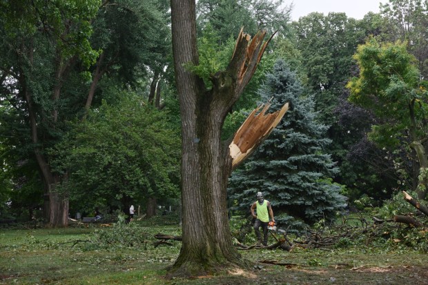 City workers clean fallen trees, limbs and debris Monday, July 6, 2026, at West Park in Allentown. Storms that hit the Lehigh Valley over the weekend caused damage in the park, as well as road closures and power outages throughout the region. (Monica Cabrera/The Morning Call)