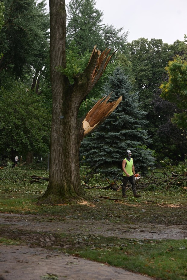 City workers clean fallen trees, limbs and debris Monday, July 6, 2026, at West Park in Allentown. Storms that hit the Lehigh Valley over the weekend caused damage in the park, as well as road closures and power outages throughout the region. (Monica Cabrera/The Morning Call)