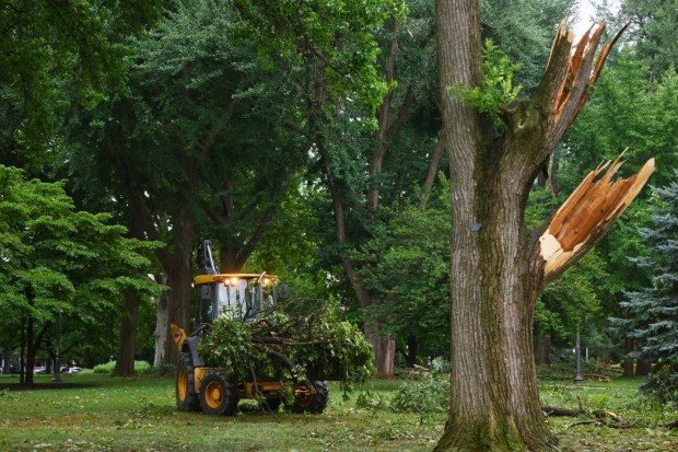 City workers clean fallen trees, limbs and debris Monday, July 6, 2026, at West Park in Allentown. Storms that hit the Lehigh Valley over the weekend caused damage in the park, as well as road closures and power outages throughout the region. (Monica Cabrera/The Morning Call)