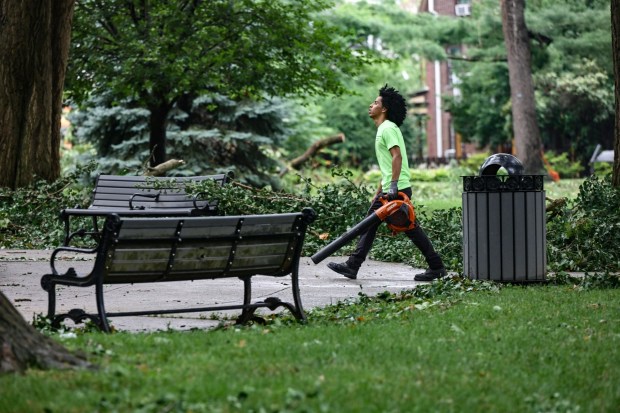 City workers clean fallen trees, limbs and debris Monday, July 6, 2026, at West Park in Allentown. Storms that hit the Lehigh Valley over the weekend caused damage in the park, as well as road closures and power outages throughout the region. (Monica Cabrera/The Morning Call)