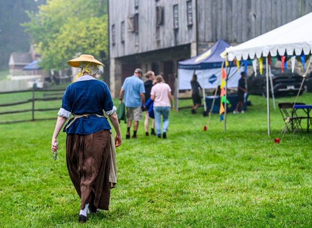 Despite the rain Saturday, July 18, 2026, people attend the Bethlehem Blueberry Festival, organized by Historic Bethlehem Museums & Sites at Burnside Plantation. The festival offers Colonial demonstrations, activities, vendor tents, blueberry-themed foods, and live music. (April Gamiz/The Morning Call)