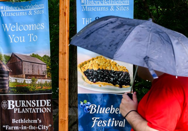 Despite the rain Saturday, July 18, 2026, people attend the Bethlehem Blueberry Festival, organized by Historic Bethlehem Museums & Sites at Burnside Plantation. The festival offers Colonial demonstrations, activities, vendor tents, blueberry-themed foods, and live music. (April Gamiz/The Morning Call)