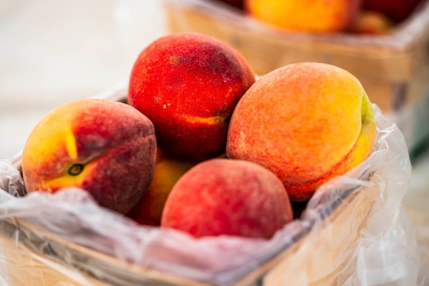 Peaches are one of the produce items for sale Tuesday, July 14, 2026, at Buzas' Greenhouse and Farm in Palmer Township. The family-owned business has been in operation for more than 75 years as a producing farm. (April Gamiz/The Morning Call)