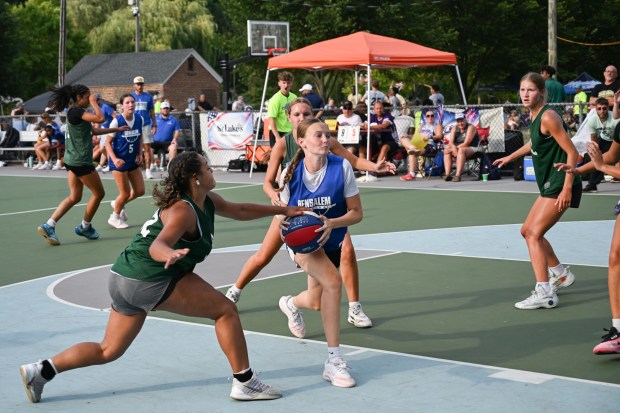 Kylie O'Neil works to evade Emmaus during their game against Bensalem during the A-Town Throwdown basketball tournament finals Sunday, July 26, 2026, in Cedar Beach in Allentown. (Jon Chiu/The Morning Call)
